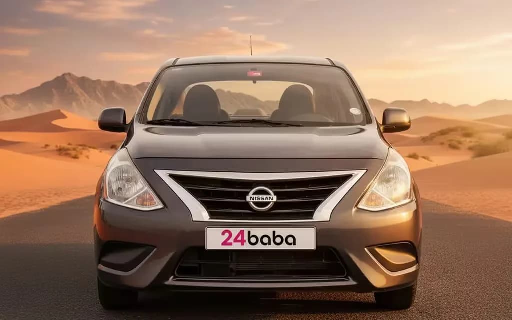Nissan Sunny 2023 Grey front view with headlights – rental in Dubai