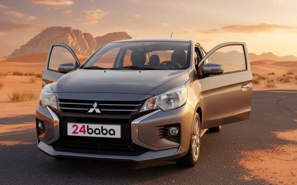 Mitsubishi Attrage 2023 Silver front view with headlights – rental in Dubai