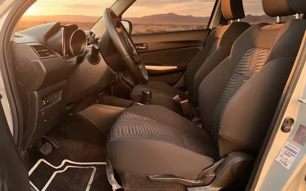 Suzuki Swift 2023 leather seats and cabin – rental in Dubai