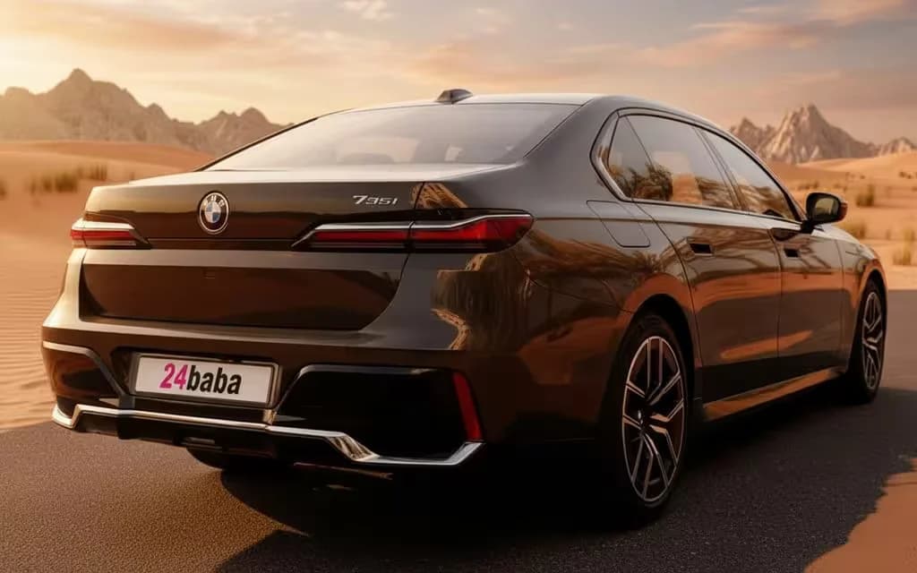 Bmw 735 2024 Black rear view showing taillights – rental in Dubai