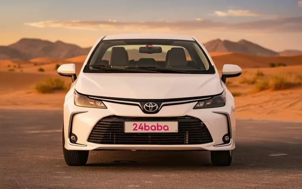 Toyota Corolla 2020 White front view with headlights – rental in Dubai