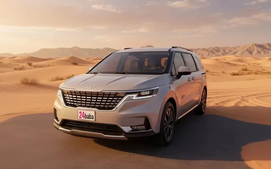 Kia Carnival 2023 Grey front view with headlights – rental in Dubai