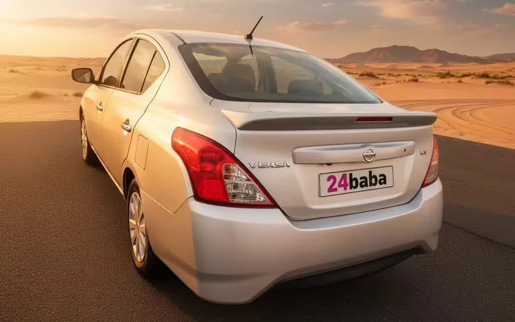 Nissan Versa 2025 Silver rear view showing taillights – rental in Dubai