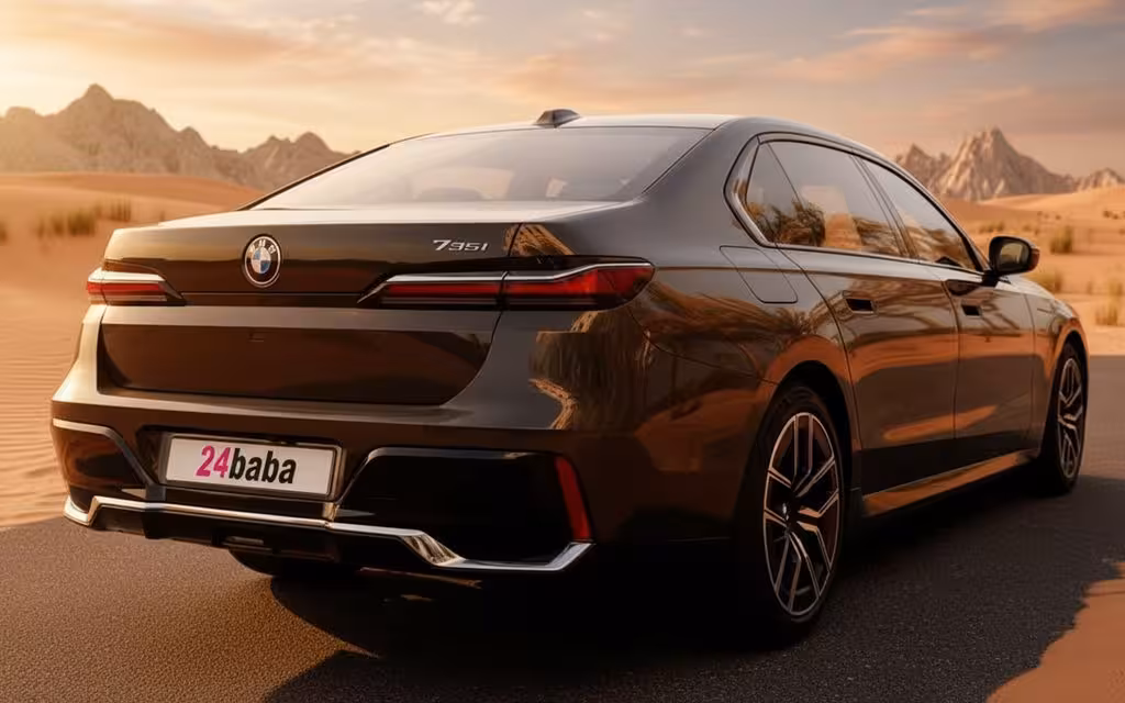 Bmw 735 2024 Black rear view showing taillights – rental in Dubai