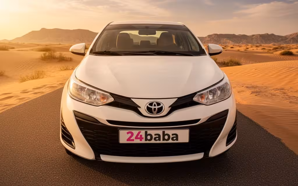 Toyota Yaris 2020 White front view with headlights – rental in Dubai