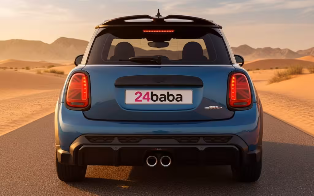 Mini Cooper 2024 Blue rear view showing taillights – rental in Dubai Mini Cooper 2024 Blue rear view showing taillights – rental in Dubai