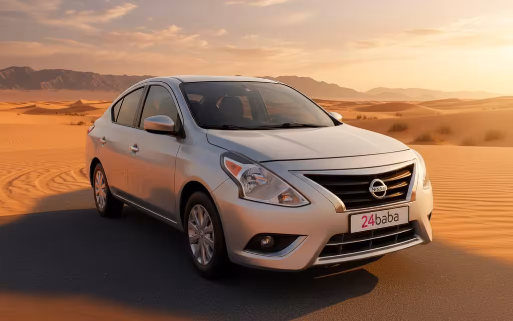 Nissan Versa 2025 Silver front view with headlights – rental in Dubai
