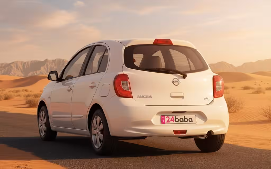 Nissan Micra 2025 White rear view showing taillights – rental in Dubai