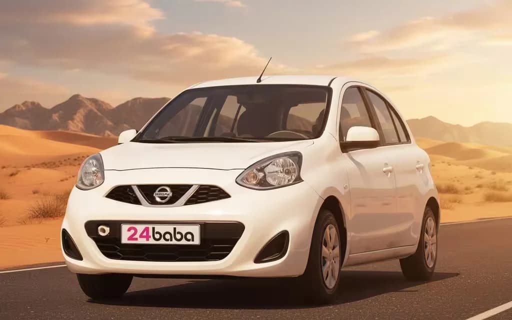 Nissan Micra 2025 White front view with headlights – rental in Dubai