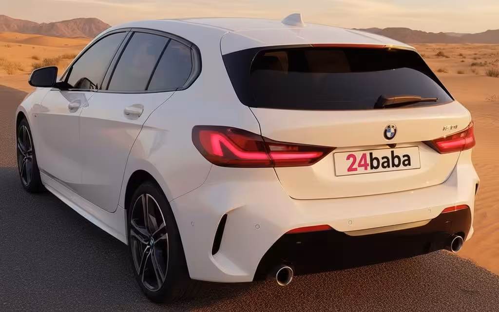 Bmw 120 2021 White rear view showing taillights – rental in Dubai