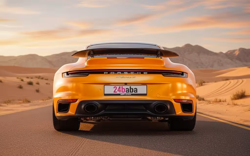 Porsche 911 2023 Orange rear view showing taillights – rental in Dubai
