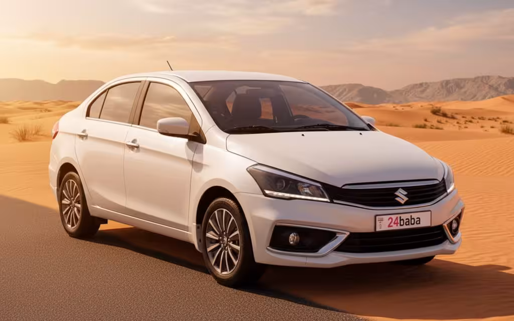 Suzuki Ciaz 2022 White front view with headlights – rental in Dubai