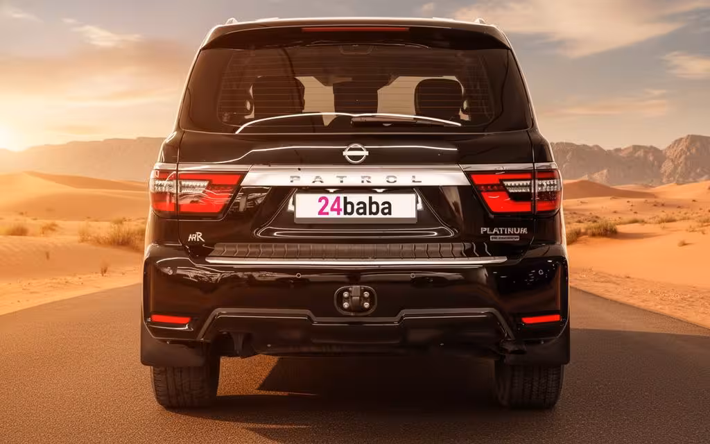 Nissan Patrol 2025 Black rear view showing taillights – rental in Dubai Nissan Patrol 2025 Black rear view showing taillights – rental in Dubai