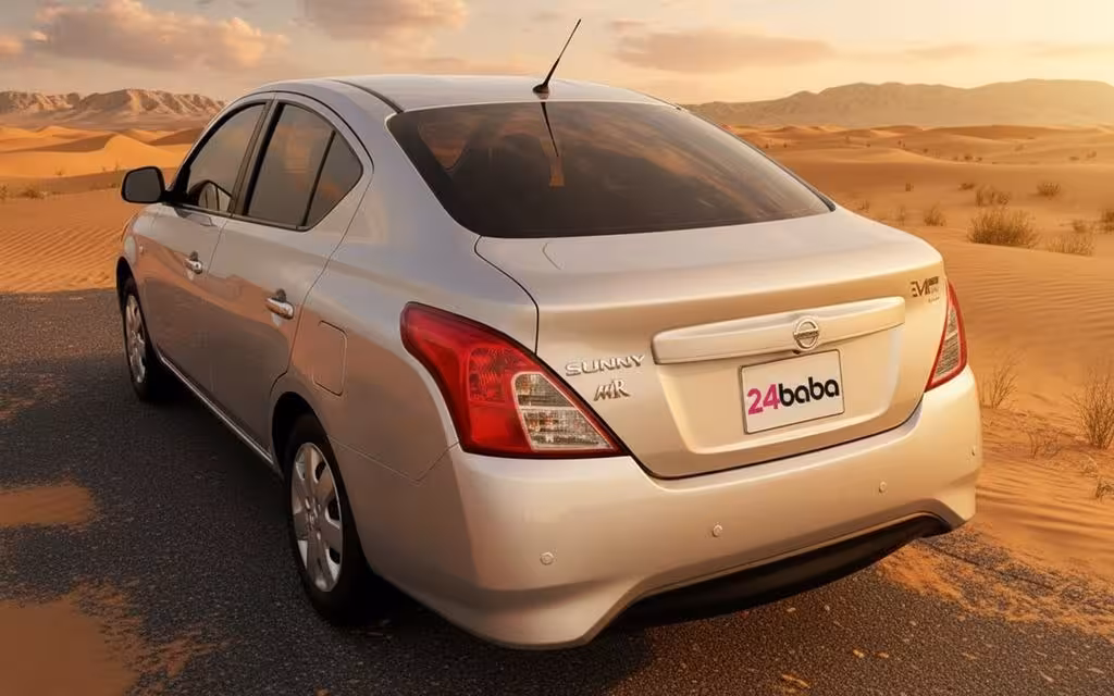 Nissan Sunny 2024 Silver rear view showing taillights – rental in Dubai