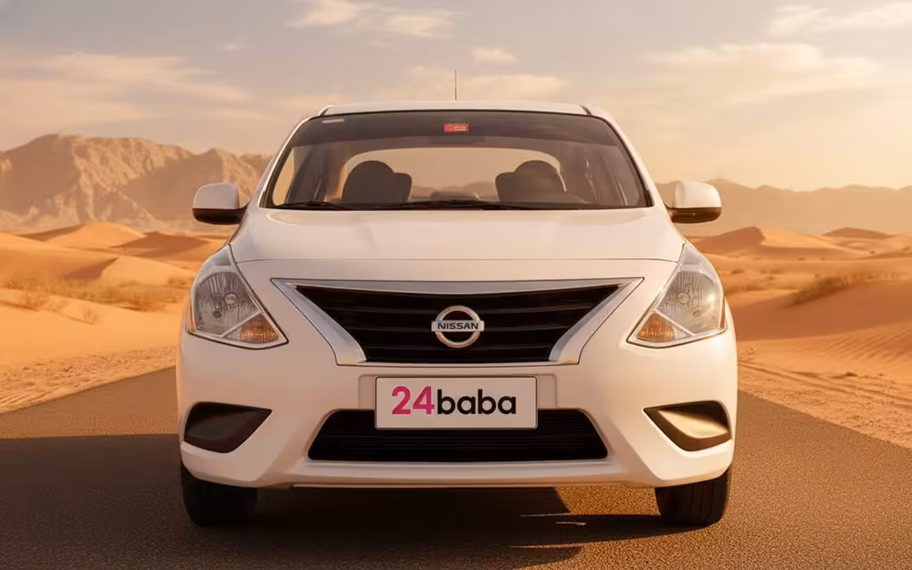 Nissan Sunny 2024 White front view with headlights – rental in Dubai