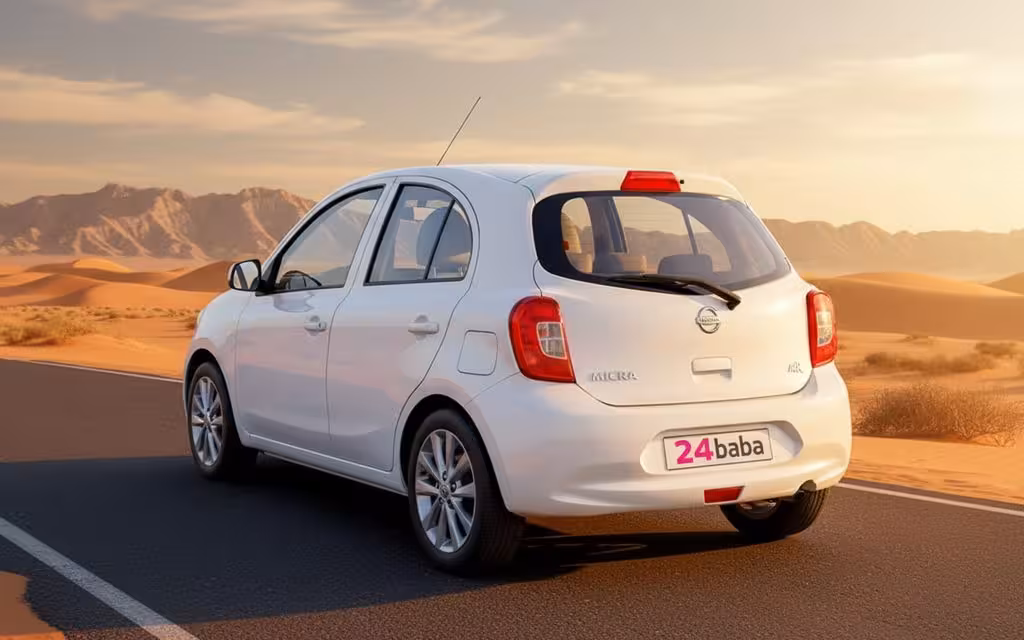 Nissan Micra 2020 White rear view showing taillights – rental in Dubai