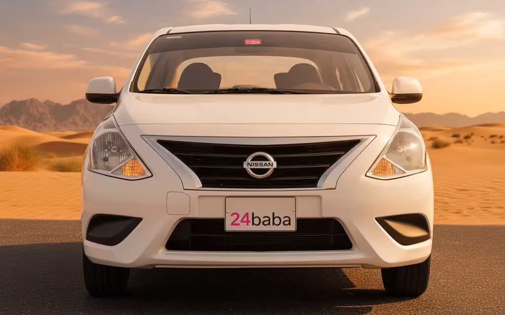 Nissan Sunny 2023 White front view with headlights – rental in Dubai