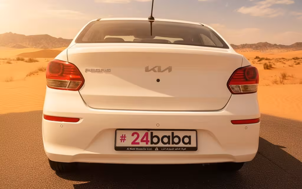 Kia Pegas 2025 White rear view showing taillights – rental in Dubai