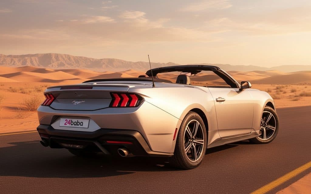 Ford Mustang 2024 Silver rear view showing taillights – rental in Dubai Ford Mustang 2024 Silver rear view showing taillights – rental in Dubai