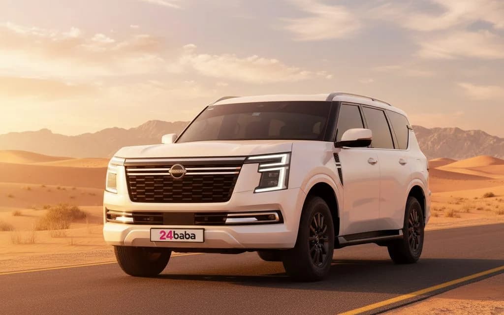 Nissan Patrol 2025 White front view with headlights – rental in Dubai