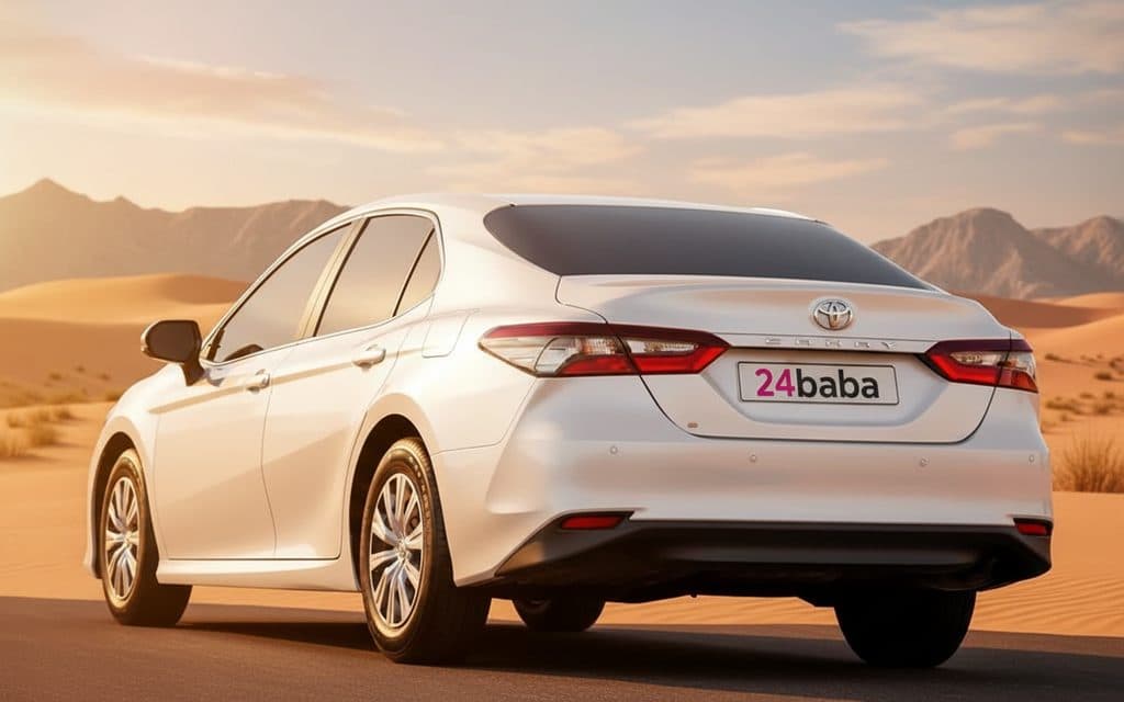 Toyota Camry 2023 White rear view showing taillights – rental in Dubai