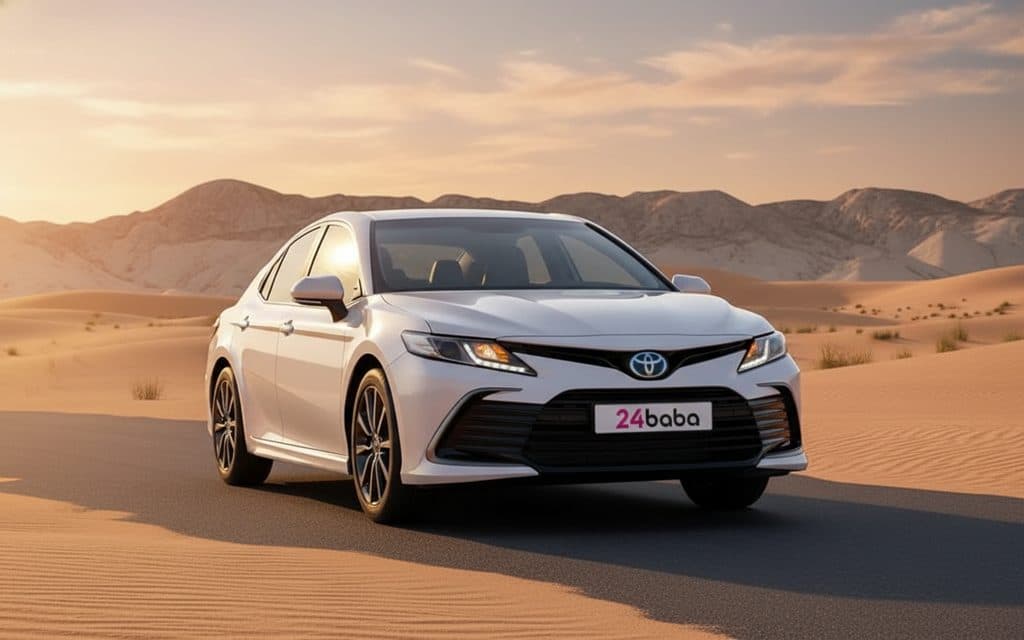 Toyota Camry 2024 White front view with headlights – rental in Dubai