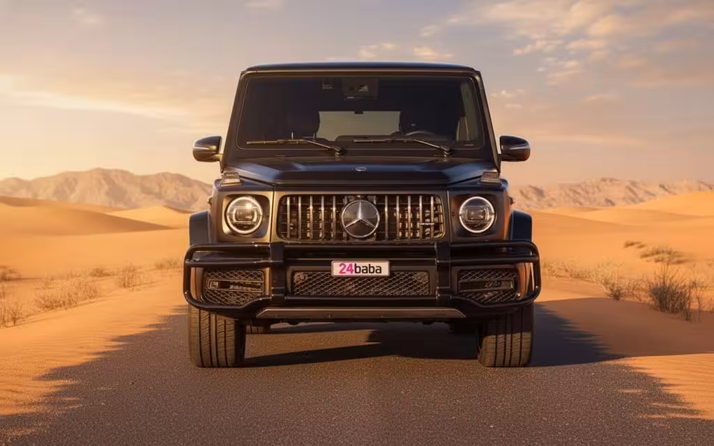 Mercedes G63 2023 Black front view with headlights – rental in Dubai