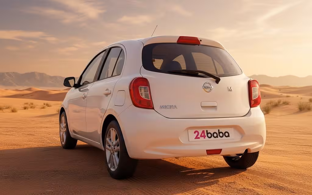 Nissan Micra 2020 White rear view showing taillights – rental in Dubai