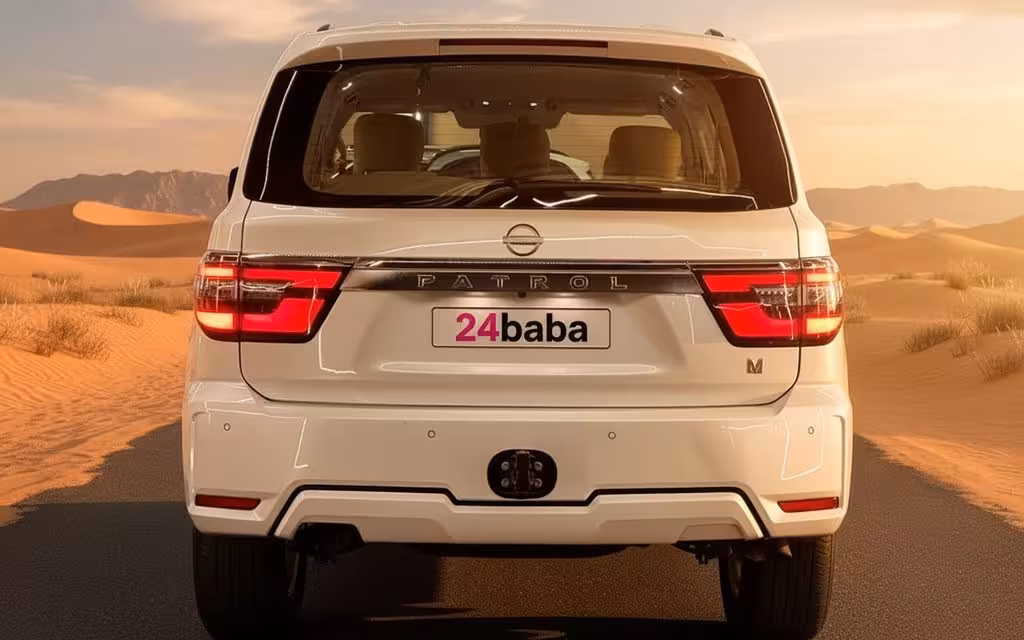 Nissan Patrol 2024 White rear view showing taillights – rental in Dubai Nissan Patrol 2024 White rear view showing taillights – rental in Dubai