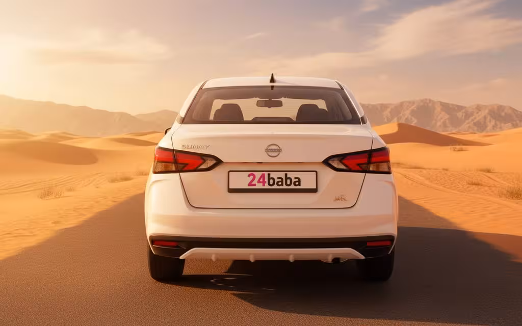 Nissan Sunny 2024 White rear view showing taillights – rental in Dubai